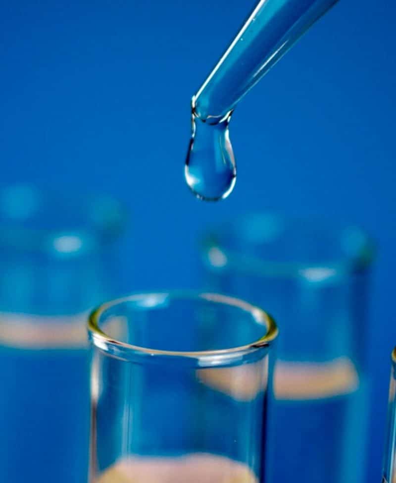 Close-up laboratory-style water sampling image for Legionella testing and analysis