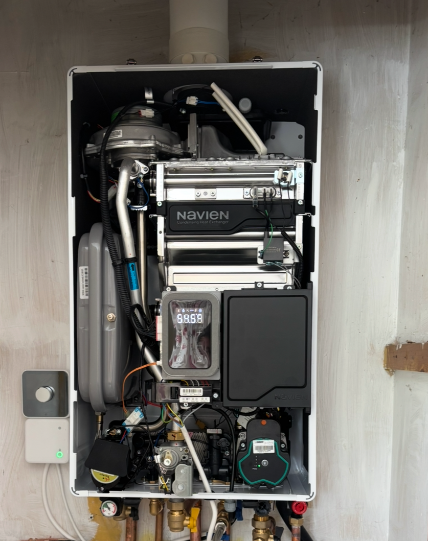 Internal view of a Navien boiler installation